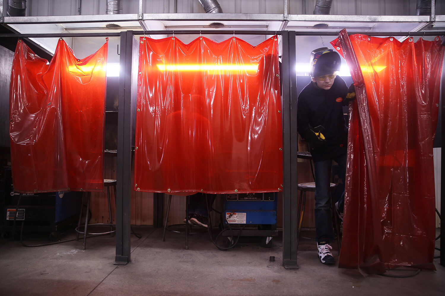 Fletcher Bentley emerges from his welding cubicle